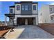 Two-story home with gray and white exterior, two-car garage, and a modern design at 4318 Emeline Ln # 20, Fuquay Varina, NC 27526