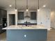 Stylish kitchen with stainless steel appliances, a large island, and pendant lighting at 4318 Emeline Ln # 20, Fuquay Varina, NC 27526