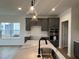 Bright kitchen featuring stainless steel appliances, a large island, and modern lighting at 4318 Emeline Ln # 20, Fuquay Varina, NC 27526