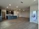 Open floorplan with hardwood floors and modern kitchen at 4318 Emeline Ln # 20, Fuquay Varina, NC 27526