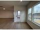 Living room featuring hardwood floors, neutral paint, and a sliding glass door to the outside at 4318 Emeline Ln # 20, Fuquay Varina, NC 27526