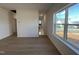 Living room with wood flooring and natural light from the large window at 4318 Emeline Ln # 20, Fuquay Varina, NC 27526