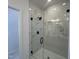 The shower features marbled-tile and a glass enclosure with black hardware at 4318 Emeline Ln # 20, Fuquay Varina, NC 27526