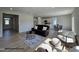 Open-concept living room with modern decor, flowing seamlessly into the kitchen and dining areas at 45 Mossman Ct, Zebulon, NC 27597