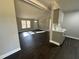 Spacious living room featuring dark laminate flooring and neutral walls at 552 Sombrero Ln, Henderson, NC 27537