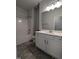 Bathroom with sleek white vanity, shower-tub combination, and tile flooring at 565 Sweet Potato Lane # 07, Nashville, NC 27856
