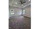 Spacious bedroom featuring plush carpet and a tray ceiling at 565 Sweet Potato Lane # 07, Nashville, NC 27856