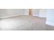 Neutral carpeted bedroom features white baseboards, neutral walls, and a closet for storage at 565 Sweet Potato Lane # 07, Nashville, NC 27856