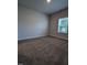 Empty bedroom with carpet, neutral walls, and one window at 565 Sweet Potato Lane # 07, Nashville, NC 27856