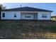 A well-kept house with white vinyl siding, a covered patio, and a yard with newly installed grass at 565 Sweet Potato Lane # 07, Nashville, NC 27856