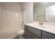Bathroom with a shower/tub combo and gray vanity at 60 Watermelon Dr, Franklinton, NC 27525