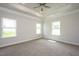 Spacious bedroom with carpeted floor and multiple windows at 60 Watermelon Dr, Franklinton, NC 27525