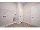 Laundry room with built-in shelving and utility hookups at 60 Watermelon Dr, Franklinton, NC 27525