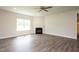 Living room with a fireplace and hardwood floors at 60 Watermelon Dr, Franklinton, NC 27525