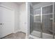 Walk-in shower with glass enclosure and gray tile at 60 Watermelon Dr, Franklinton, NC 27525
