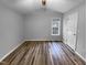 Bright bedroom with wood-look floors and a window at 610 Lockwood Dr, Clayton, NC 27527