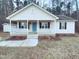 Charming one-story house with a front porch and storage shed at 610 Lockwood Dr, Clayton, NC 27527