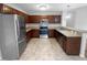 Modern kitchen with stainless steel appliances and dark wood cabinetry at 610 Lockwood Dr, Clayton, NC 27527