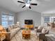 Virtually staged living room featuring a neutral color palette and modern furniture at 610 Lockwood Dr, Clayton, NC 27527