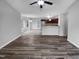 Open living space with hardwood floors and kitchen access at 610 Lockwood Dr, Clayton, NC 27527