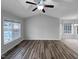 Bright living room with hardwood floors and large windows at 610 Lockwood Dr, Clayton, NC 27527