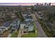 A lovely home shown in an aerial view with a big city skyline in the background at 700 Coleman St, Raleigh, NC 27610