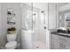 Bathroom featuring a glass shower door, toilet, and plant pot at 700 Coleman St, Raleigh, NC 27610