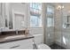Bright bathroom with a walk-in shower, dark countertops, and modern fixtures at 700 Coleman St, Raleigh, NC 27610
