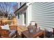 Wooden deck with seating area and surrounding greenery at 700 Coleman St, Raleigh, NC 27610