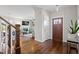 Welcoming entryway featuring hardwood floors, a staircase, and modern decor at 700 Coleman St, Raleigh, NC 27610