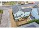 Charming two-story light blue home with a wooden deck and a well-maintained landscaped yard at 700 Coleman St, Raleigh, NC 27610
