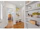 Mud room area with decorative shelving and dark wood floors at 700 Coleman St, Raleigh, NC 27610