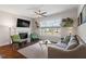 Bright living room features a fireplace, large window and comfortable seating at 700 Coleman St, Raleigh, NC 27610