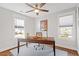 Bright room with wooden desk, natural light, and hardwood floors at 700 Coleman St, Raleigh, NC 27610