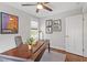 Office with wood desk, overhead fan, and three pieces of art on the wall at 700 Coleman St, Raleigh, NC 27610