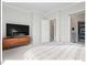 Spacious bedroom featuring a tv, a large closet and a large window for plenty of natural light at 712 E Edenton St # 105, Raleigh, NC 27601
