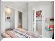 Bedroom displaying doors leading to a bathroom, staircase, and closet for functionality and convenience at 712 E Edenton St # 105, Raleigh, NC 27601