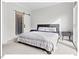 Relaxing bedroom with a full bed, a stylish barn door leading to the bathroom and two end tables at 712 E Edenton St # 105, Raleigh, NC 27601