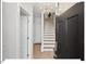 Bright entryway with staircase, light wood floors, and neutral walls at 712 E Edenton St # 105, Raleigh, NC 27601
