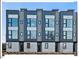 Modern three-story townhouses with gray siding and large windows at 712 E Edenton St # 105, Raleigh, NC 27601
