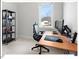 Bright home office with large window, comfortable chair, and spacious desk at 712 E Edenton St # 105, Raleigh, NC 27601