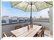 Rooftop deck offering city views and dining space at 712 E Edenton St # 105, Raleigh, NC 27601