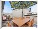 Outdoor rooftop deck with seating and a dining area at 712 E Edenton St # 105, Raleigh, NC 27601