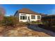 Home exterior with stone pathway and sunroom addition at 7845 Hasentree Lake Dr, Wake Forest, NC 27587