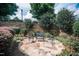 Landscaped patio with seating area in the backyard at 7845 Hasentree Lake Dr, Wake Forest, NC 27587