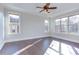 Bright bedroom with hardwood floors and multiple windows at 7845 Hasentree Lake Dr, Wake Forest, NC 27587