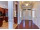 Bright entryway with hardwood floors, high ceilings, and views into the kitchen at 7845 Hasentree Lake Dr, Wake Forest, NC 27587