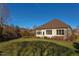 Rear view of charming house with lawn and landscaping at 7845 Hasentree Lake Dr, Wake Forest, NC 27587