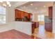 Kitchen with dark wood cabinets, granite countertops, and an island at 7845 Hasentree Lake Dr, Wake Forest, NC 27587
