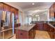 Island kitchen with stainless steel appliances and granite countertops at 7845 Hasentree Lake Dr, Wake Forest, NC 27587